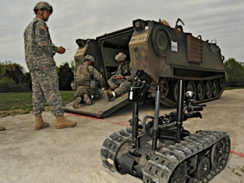 U.S. Army soldiers and a TALON robot, a military robot that is not (yet) autonomous