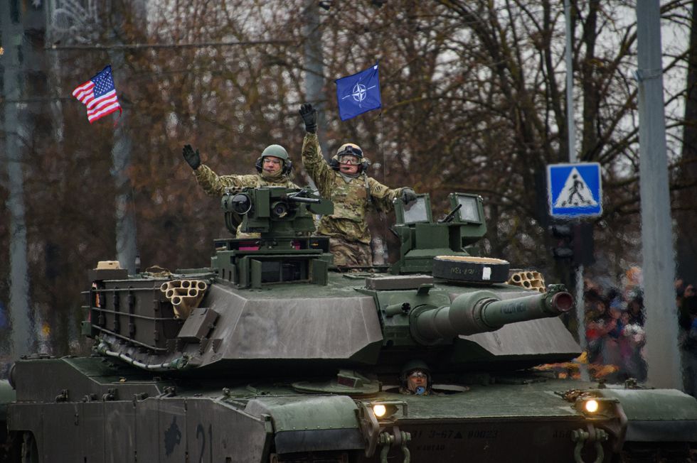 U.S. Army tanks Abrams take part in a military parade during Armed Forces Day in Vilnius.