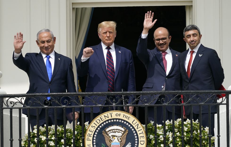 U.S. President Donald Trump, Israeli Prime Minister Benjamin Netanyahu, UAE Foreign Minister Sheikh Abdullah bin Zayed Al Nahyan, and Bahrain Foreign Minister Dr. Abdullatif bin Rashid Al Zayani wave after the Abraham Accords signing ceremony at the White House.