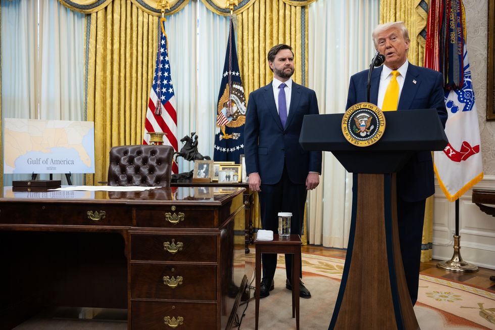 U.S. President Donald Trump speaks in the Oval Office of the White House in Washington on Feb. 21, 2025, as U.S. Vice President JD Vance looks on.