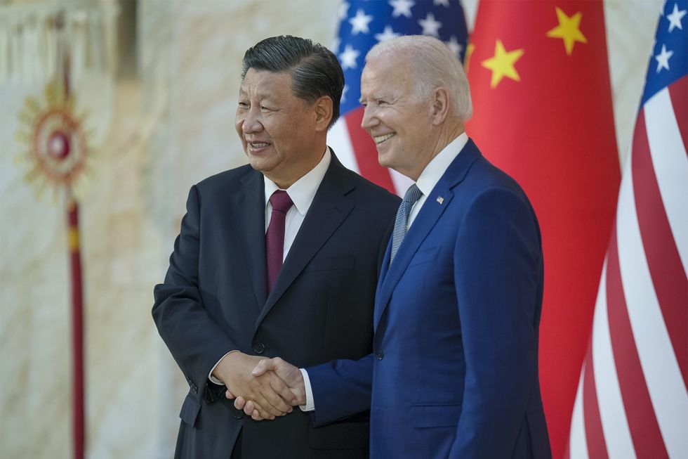 U.S. President Joe Biden shakes hands with Chinese President Xi Jinping before their face-to-face bilateral meeting on the sidelines of the G20 Summit