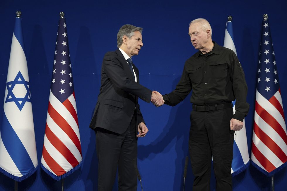 U.S. Secretary of State Antony Blinken shakes hands with Israeli Defense Minister Yoav Gallant before a bilateral meeting.