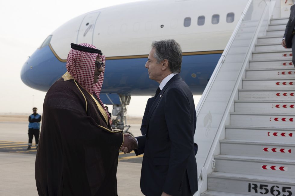 U.S Secretary of State Tony Blinken is greeted on arrival by MFA Director of Protocol Mohammed Al-Ghamdi.
