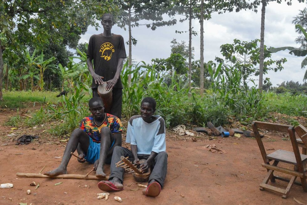 Ugandan musicians demonstrating a traditional funeral ensemble.