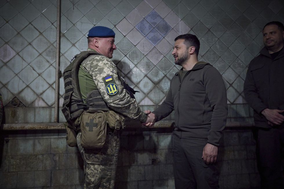 Ukrainian President Volodymyr Zelensky shaking hands with Ukraine Marines commander in Vuhledar, Donetsk Oblast, Ukraine.