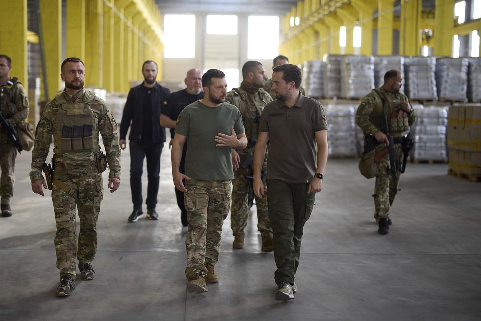 Ukrainian President Volodymyr Zelensky tours a humanitarian aid distribution center at the Mechnikov Hospital