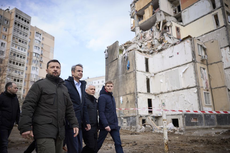 Ukrainian President Volodymyr Zelenskyy and Greek Prime Minister Kyriakos Mitsotakis tour a residential area destroyed by a Russian drone strike.