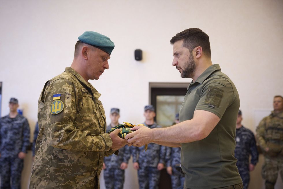 Ukrainian President Volodymyr Zelenskyy awards battle flags to Marines in Odesa.