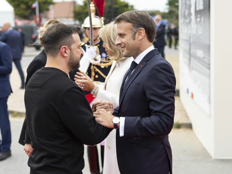 Ukrainian President Volodymyr Zelenskyy, left, greets French President Emmanuel Macron, right, during the 80th anniversary commemoration at the Omaha Beach Memorial, June 6, 2024, in Saint-Laurent-sur-Mer, Normandy, France. (Credit Image: © Ukraine Presidency/Ukrainian Pre/Planet Pix via ZUMA Press Wire)