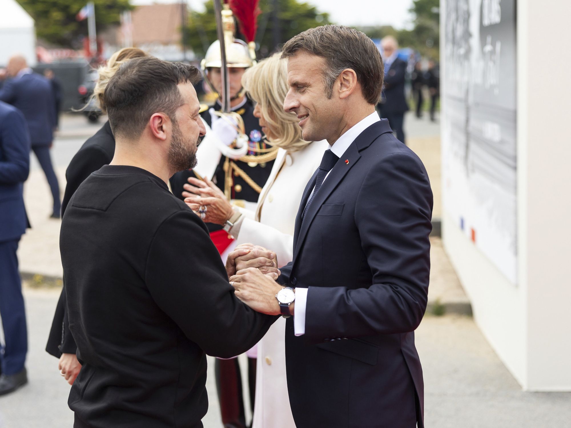 Ukrainian President Volodymyr Zelenskyy, left, greets French President Emmanuel Macron, right, during the 80th anniversary commemoration at the Omaha Beach Memorial, June 6, 2024, in Saint-Laurent-sur-Mer, Normandy, France. (Credit Image: © Ukraine Presidency/Ukrainian Pre/Planet Pix via ZUMA Press Wire)