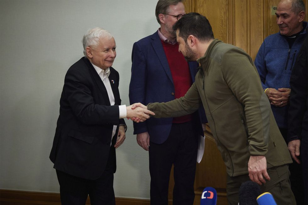 Ukrainian President Volodymyr Zelenskyy, shakes hands with Polish Deputy Prime Minister Jaroslaw Kaczynski, before a press conference in Kyiv in March before the latter seems to have changed his approach to Ukraine.