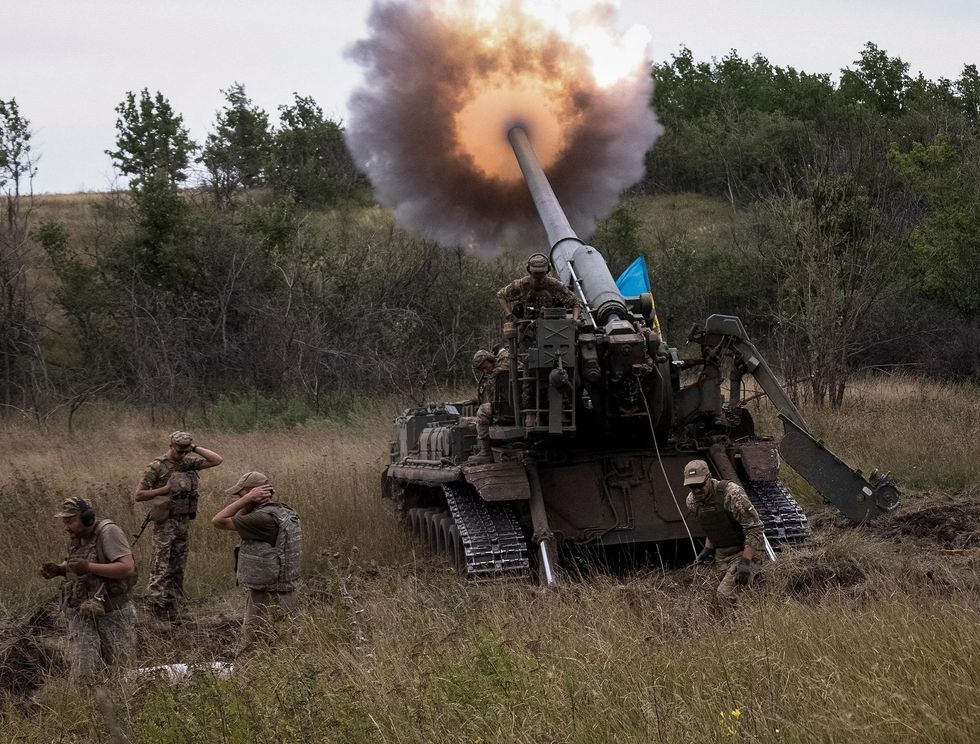 Ukrainian servicemen fire at a position in the Donetsk region on August 26.
