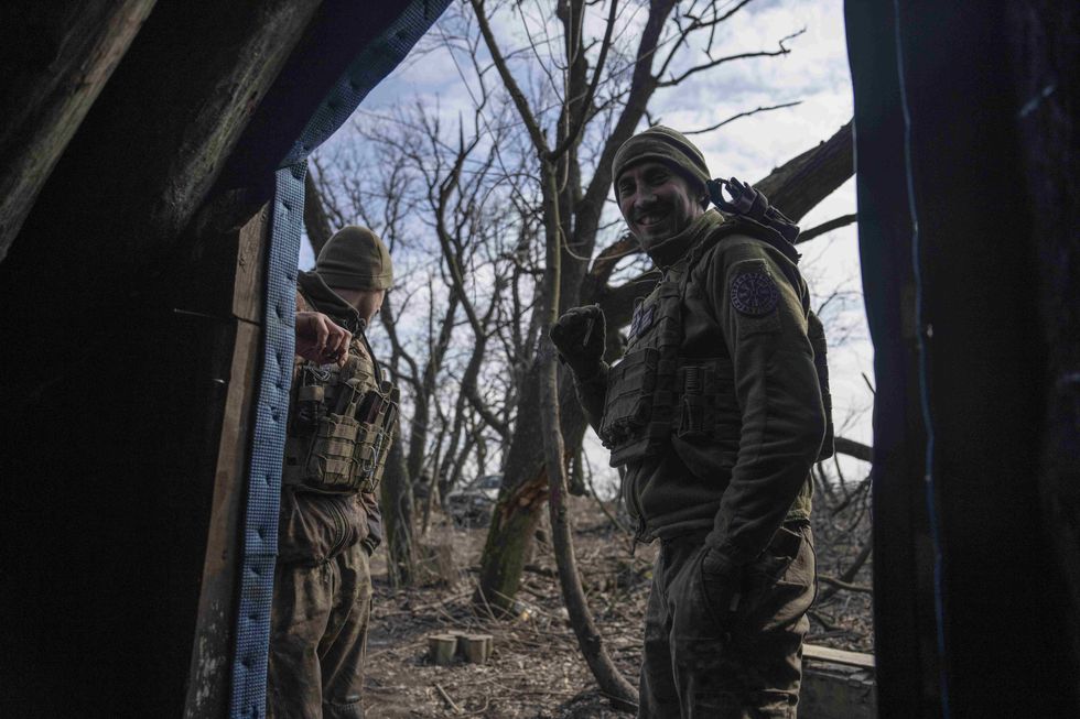 Ukrainian soldiers stand outside a bunker in Donbas, Ukraine.