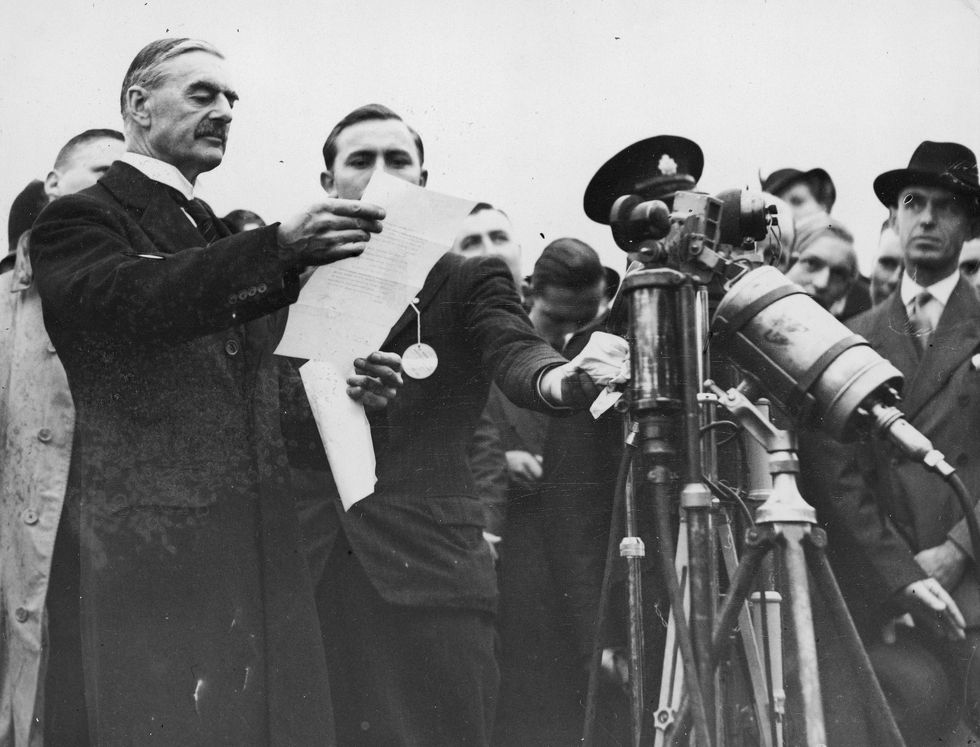 UK's Neville Chamberlain at the signing of the Munich Agreement in 1938