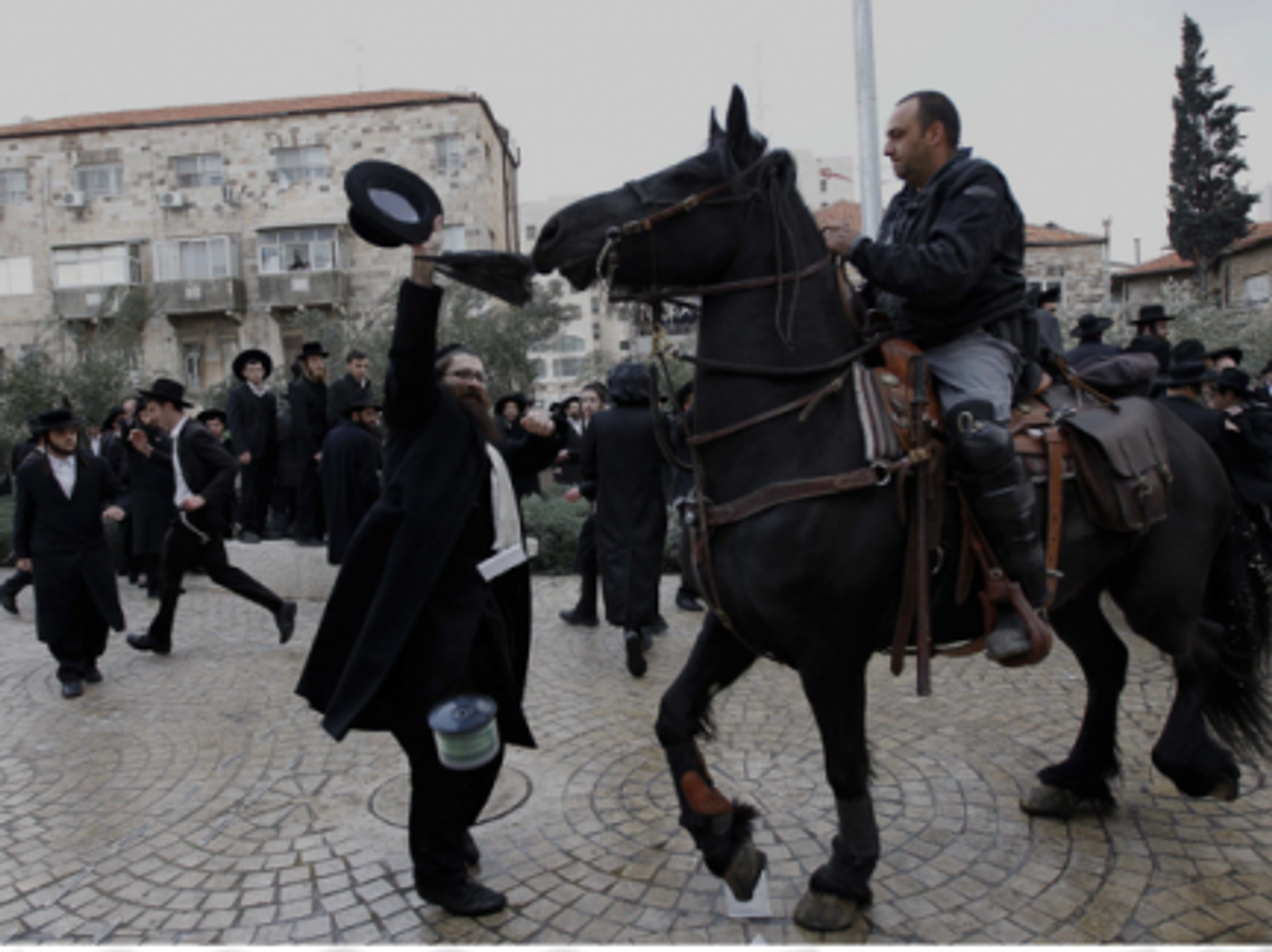 Ultra-Orthodox Jews in Israel protest cutting funds to seminary students who avoid military service.