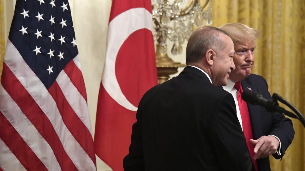 United States President Donald J. Trump shakes hands with Turkish President Recep Tayyip Erdogan after a press conference at the White House in 2019.