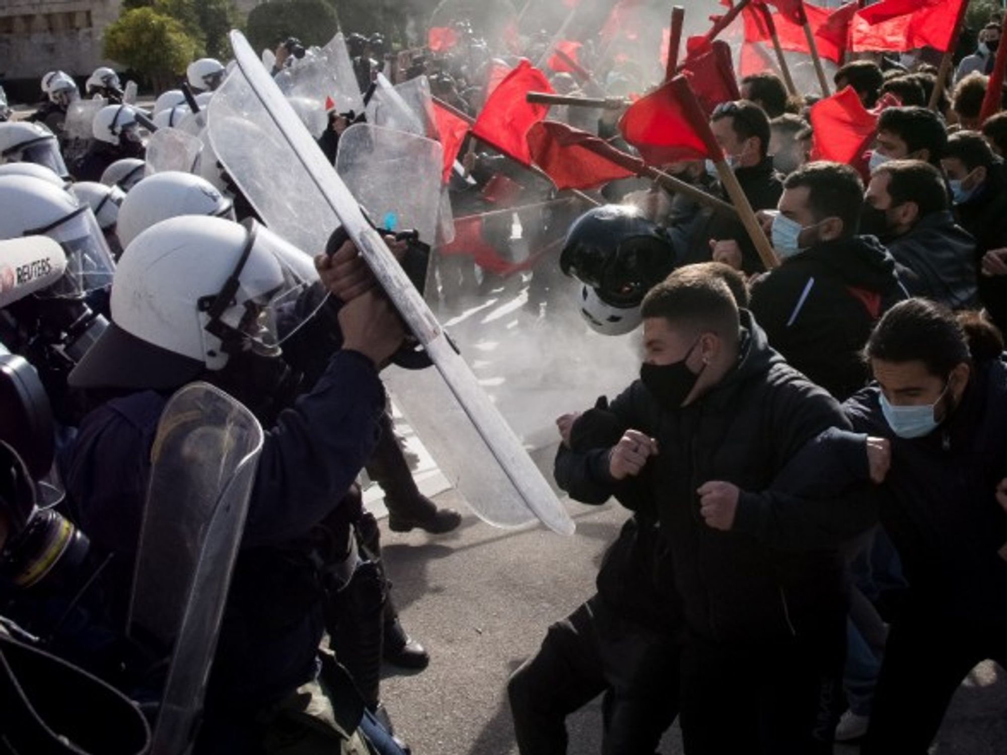 University students in Athens clash with police forces during a protest against a government bill that would allow the creation of a special campus police force and disciplinary councils in national universities.