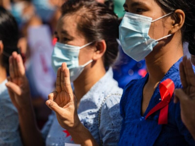 University teachers in Yangon raise the three finger salute to protest the military coup in Myanmar