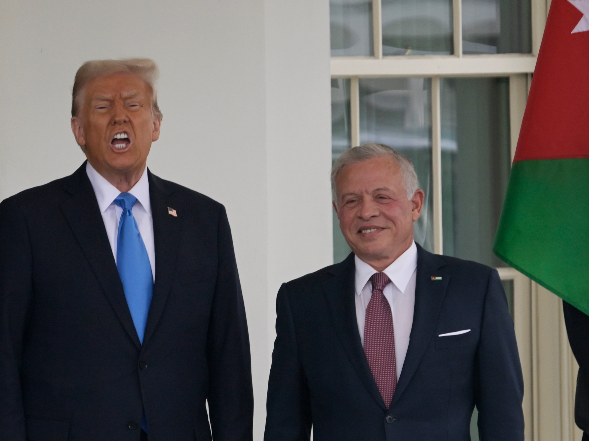 US President Donald Trump greets the King of Jordan Abdullah II bin Al-Hussein(R)