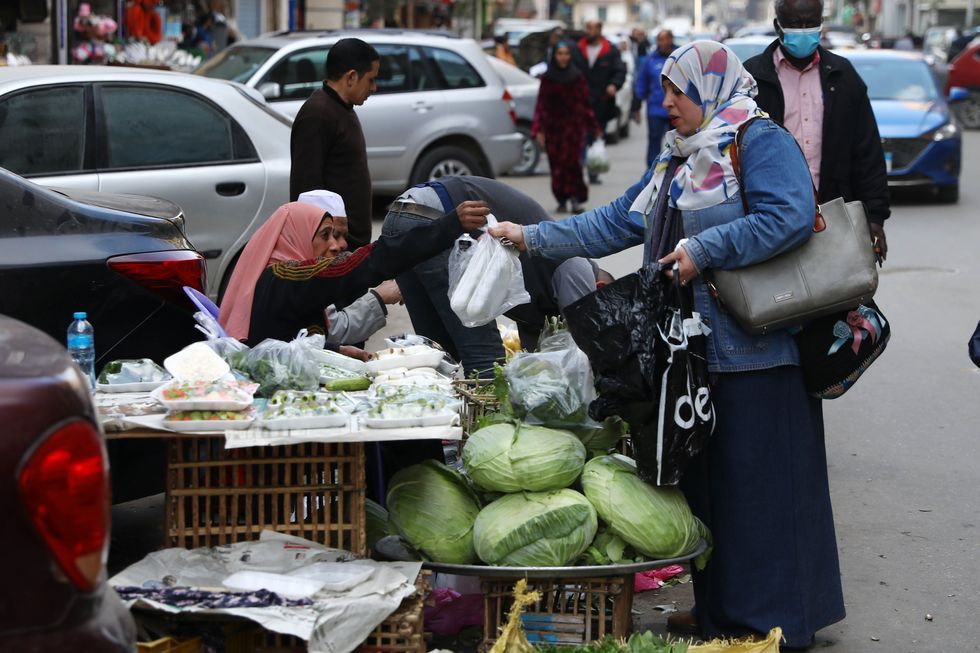 Vendors sell vegetables at a market in Cairo, Egypt.