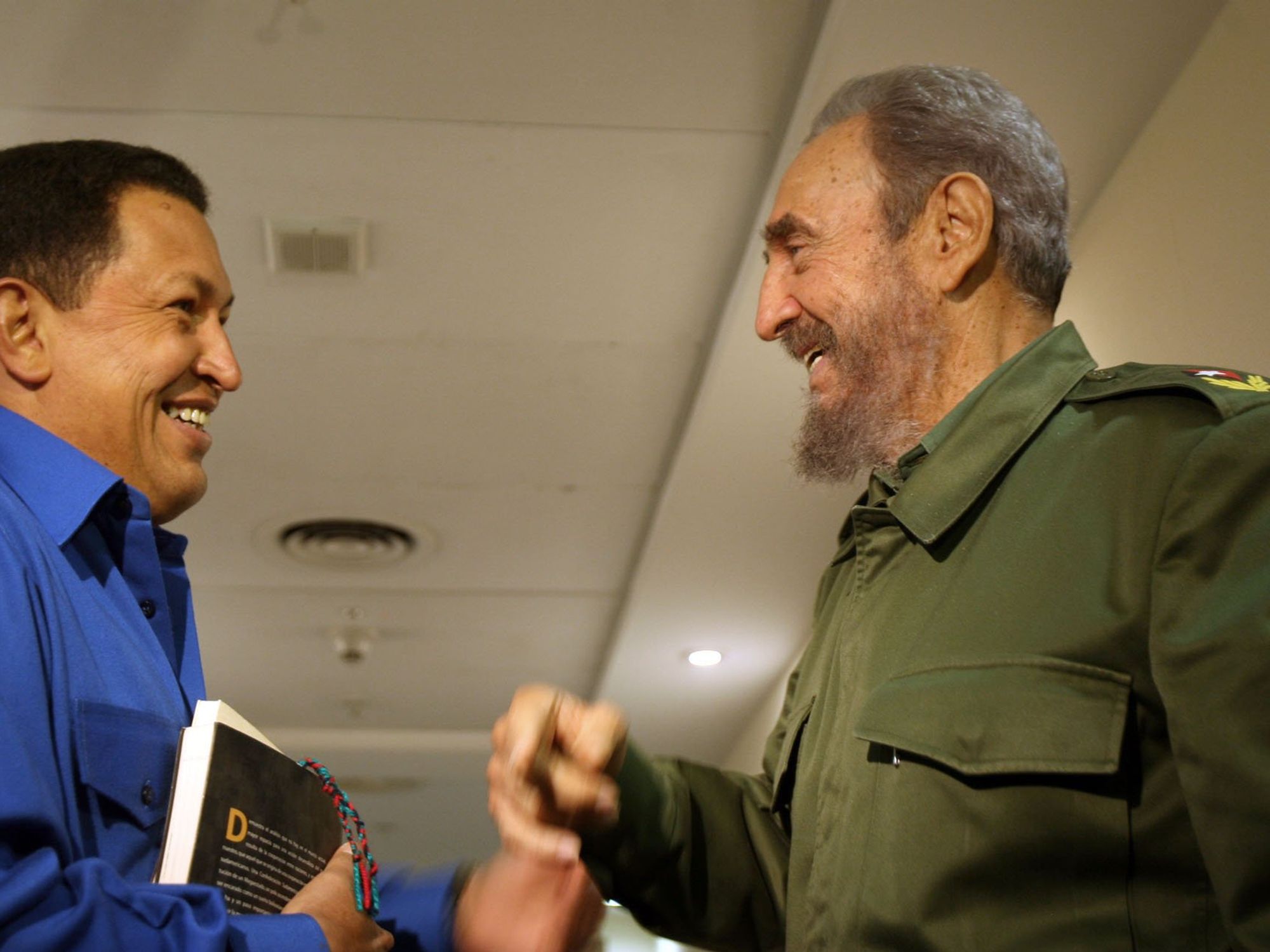 Venezuelan President Hugo Chavez , left, talks with his Cuban counterpart Fidel Castro during a summit in 2006.