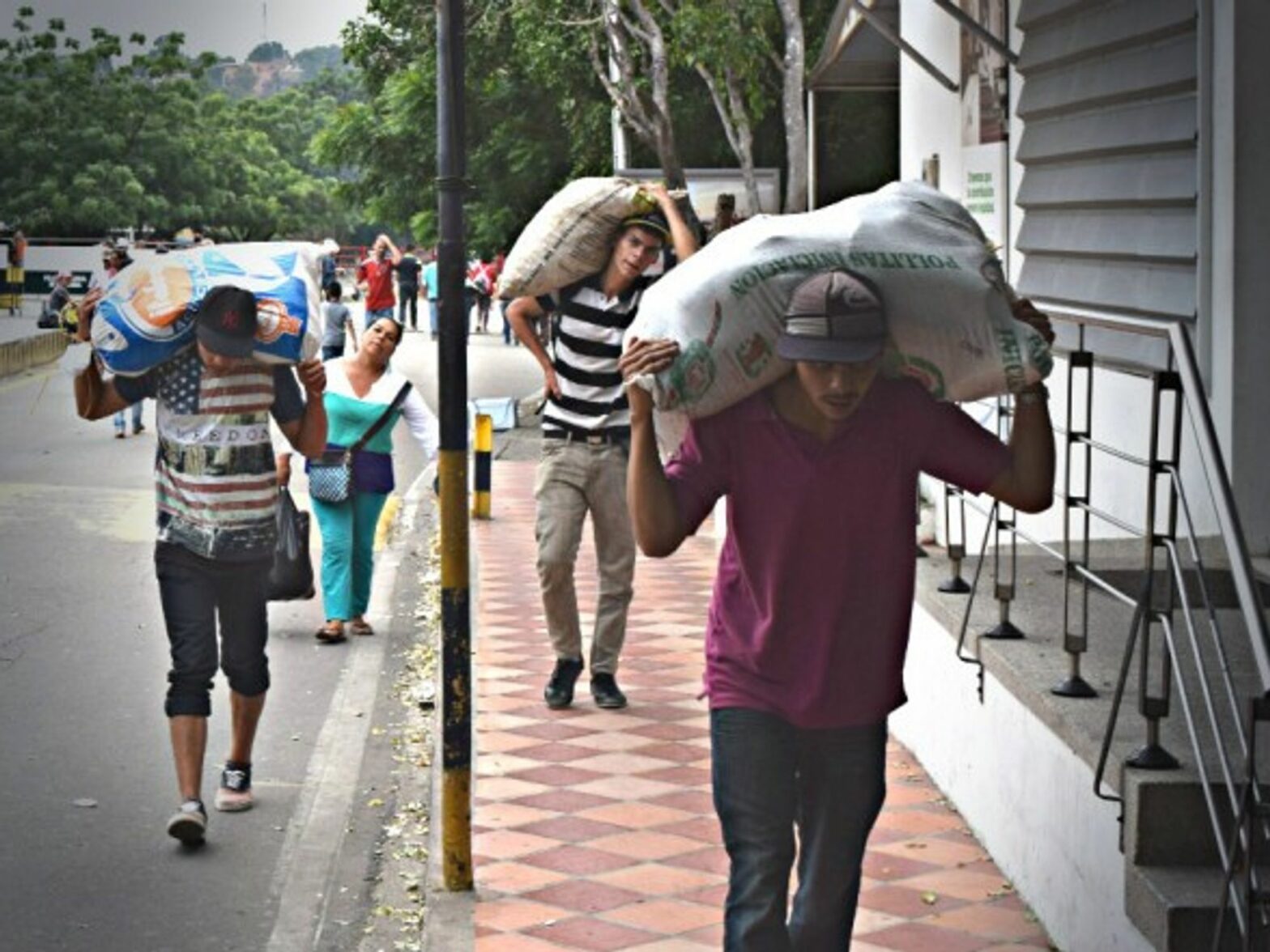 Venezuelans carry food across the Colombian border last December.