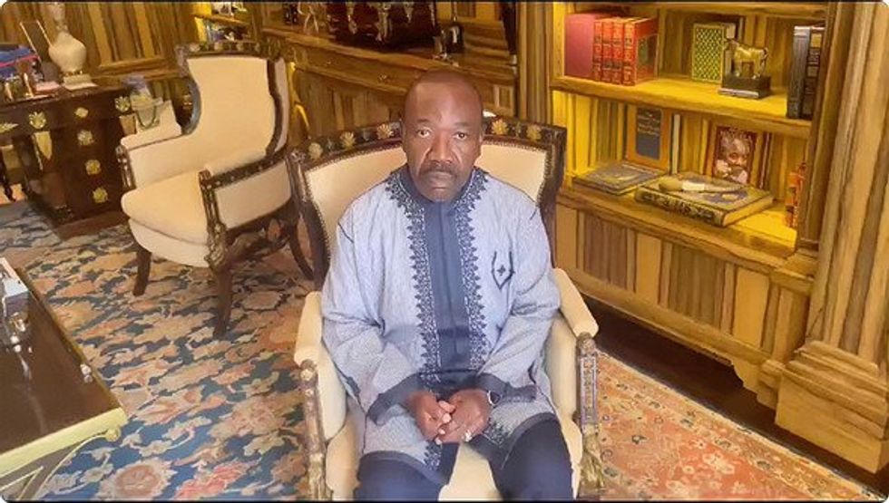 Video screenshot showing Gabonese President Ali Bongo sitting on a chair.