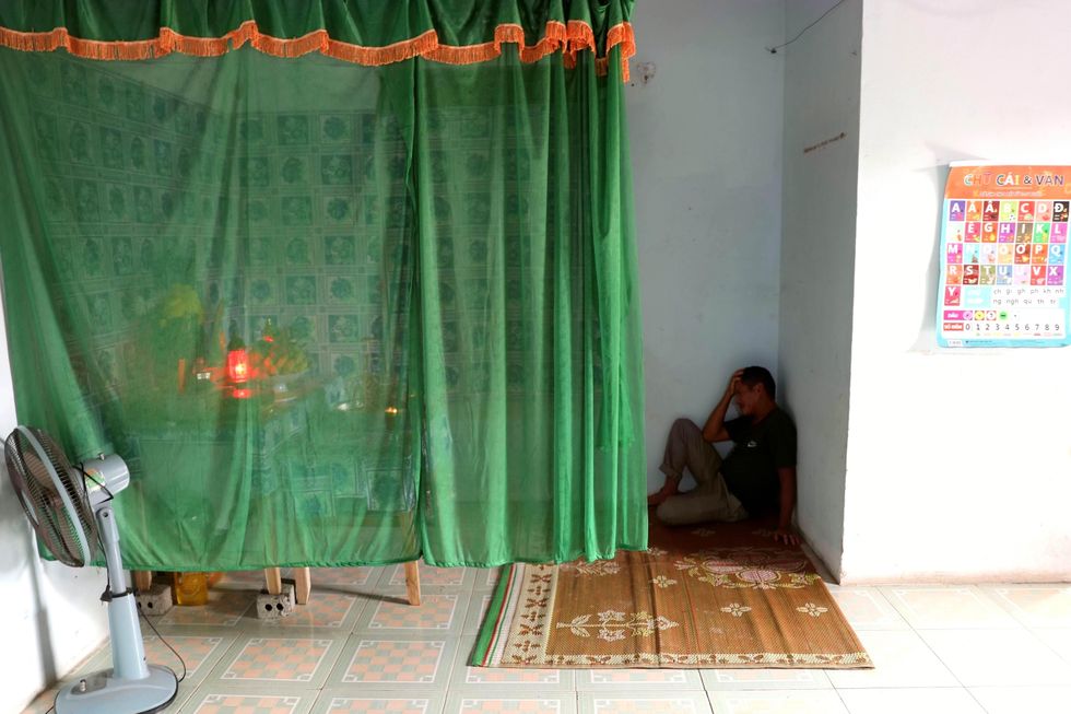 Vietnamese grieving the death of his brother
