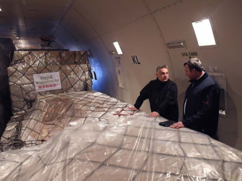 Viktor Orban (left) inspecting medical supplies from China aboard a plane in Budapest