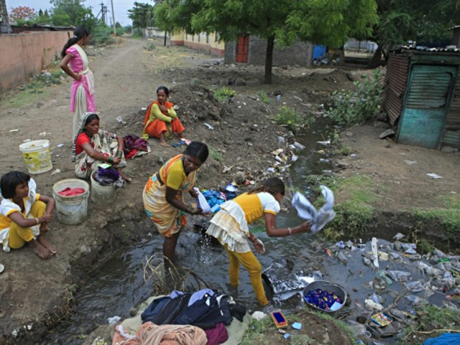 Villagers in a drainage system