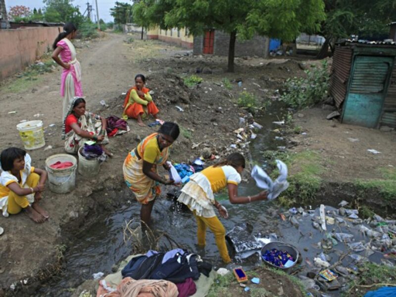 Villagers in a drainage system