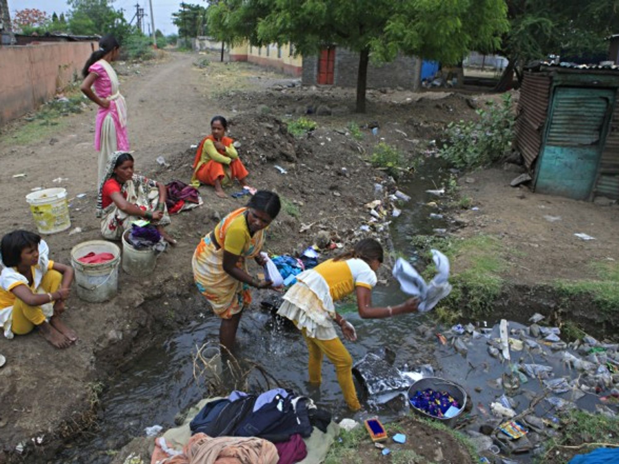 Villagers in a drainage system