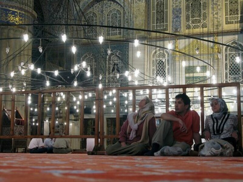Visitors to the Sultan Ahmed Mosque in Istanbul, Turkey