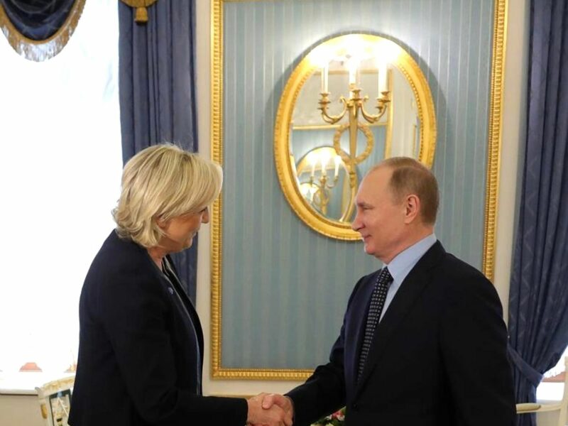 Vladimir Putin greets Marine Le Pen for an meeting at the Kremlin