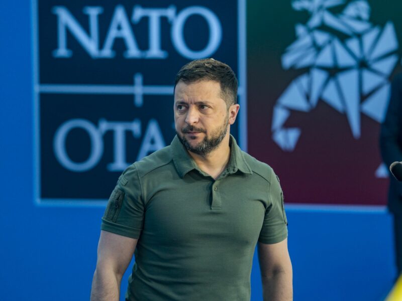 Volodymyr Zelenskiy in front of a NATO backdrop