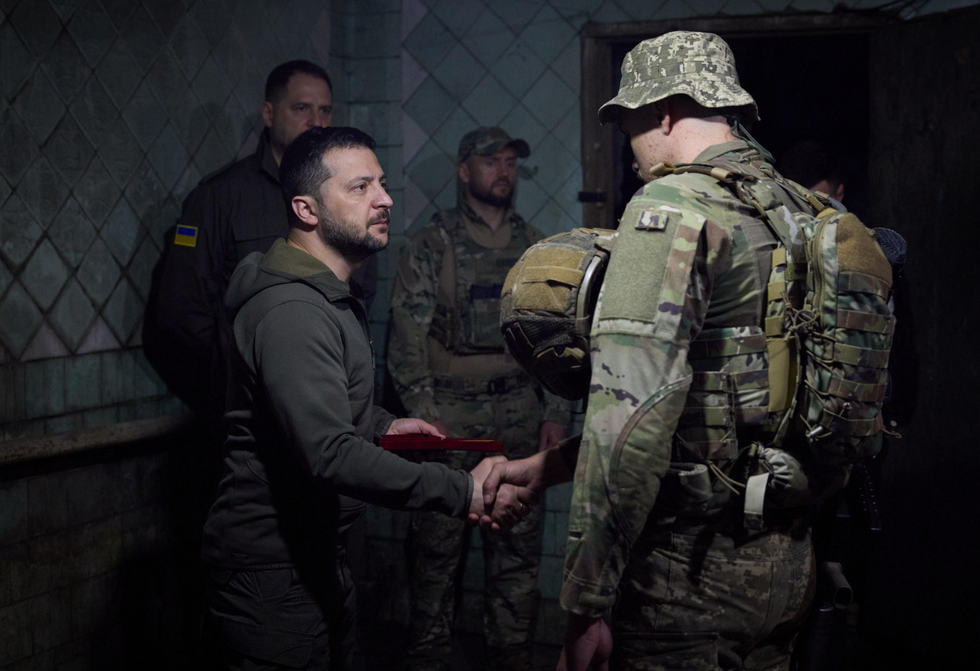 Volodymyr Zelensky and Ukrainian soldier.