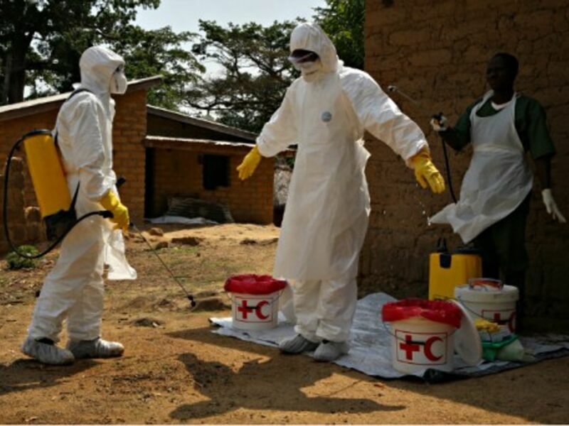 Volunteers battling Ebola in Gueckedou, Guinea, in April 2014