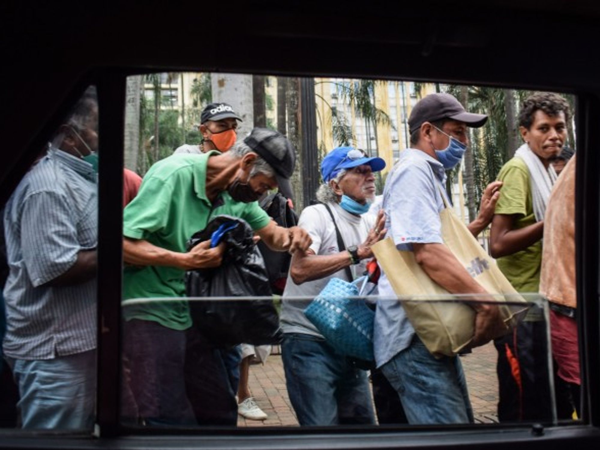 Volunteers provide food aid in the center of Cali, Colombia.