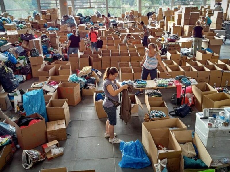 Volunteers separate items at the Nurburgring donation center after Germany's devastating flooding
