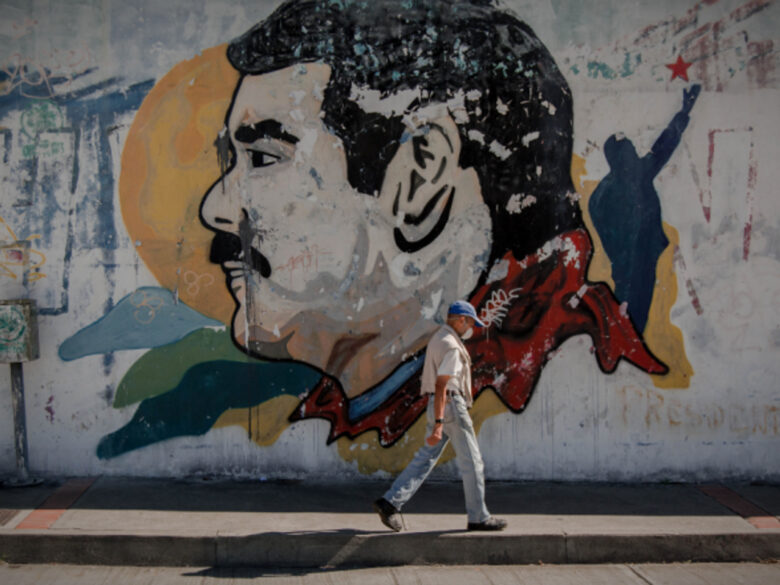 Walking past a Maduro mural in Caracas, Venezuela