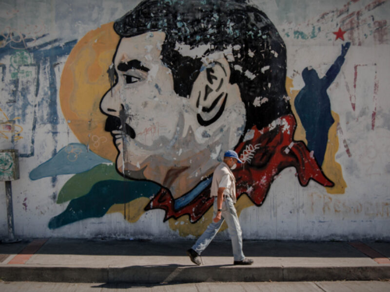 Walking past a Maduro mural in Caracas, Venezuela