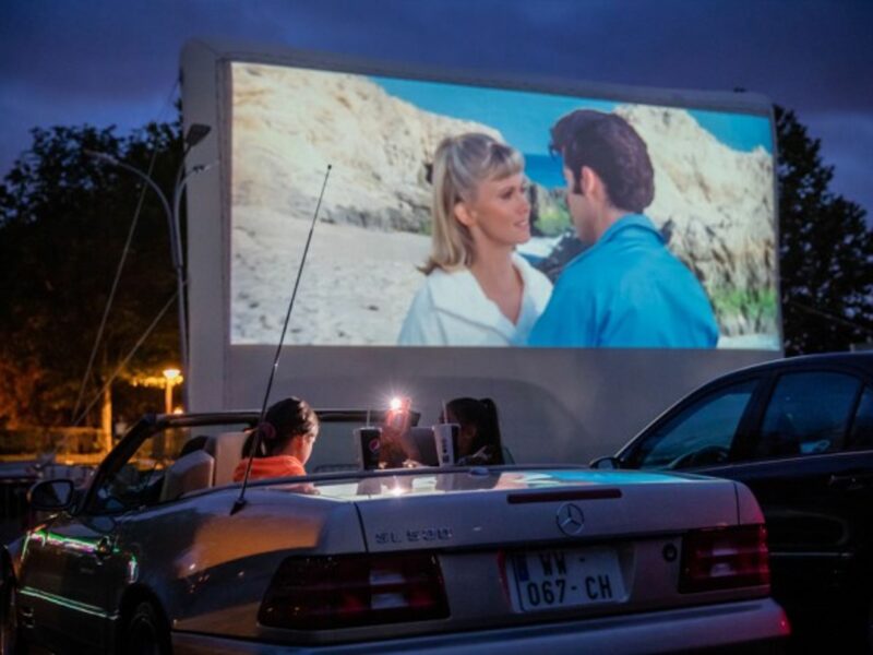 Watching a movie at a drive-in theater