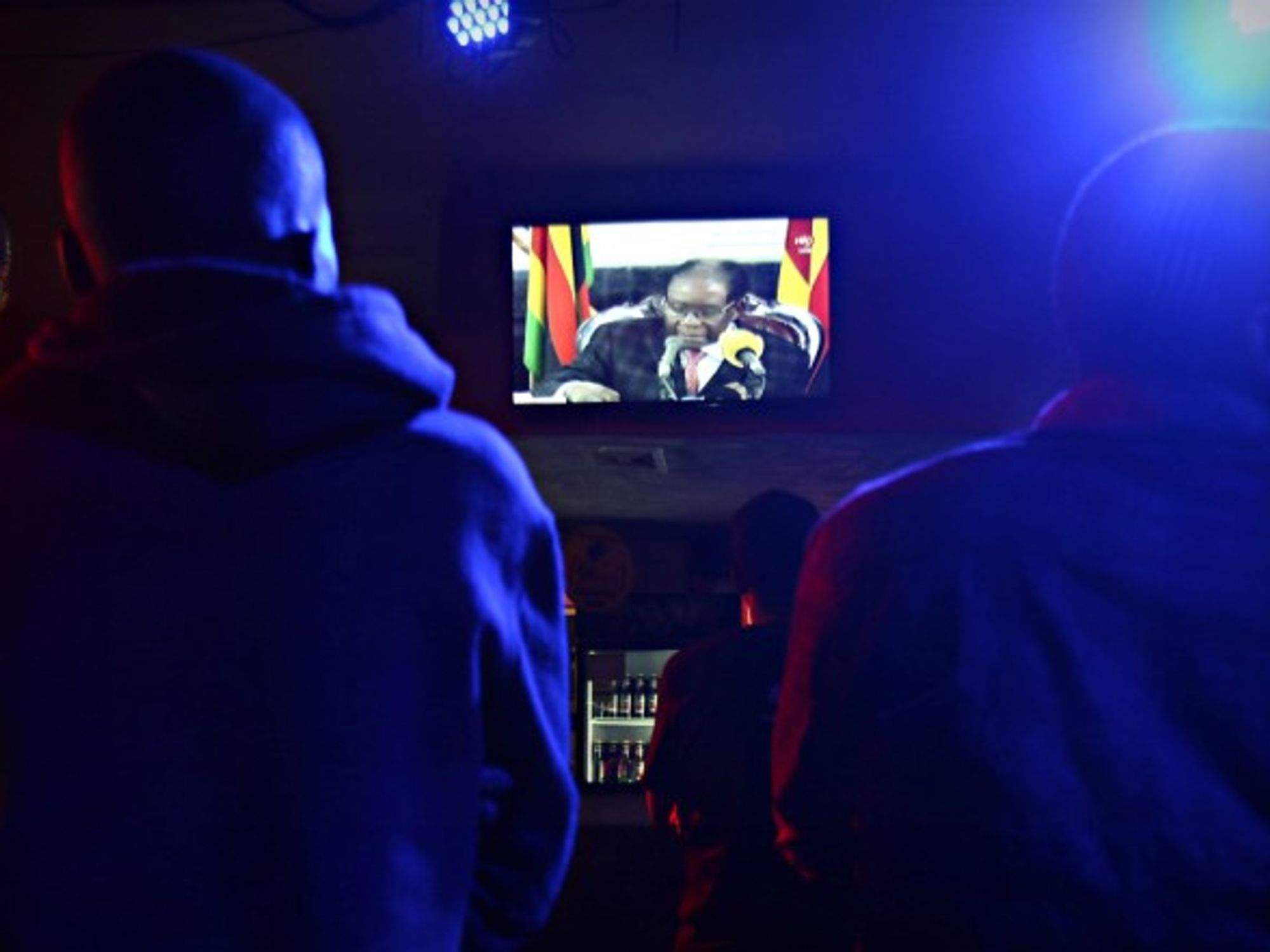 Watching Mugabe's address on TV in Harare on Nov. 19