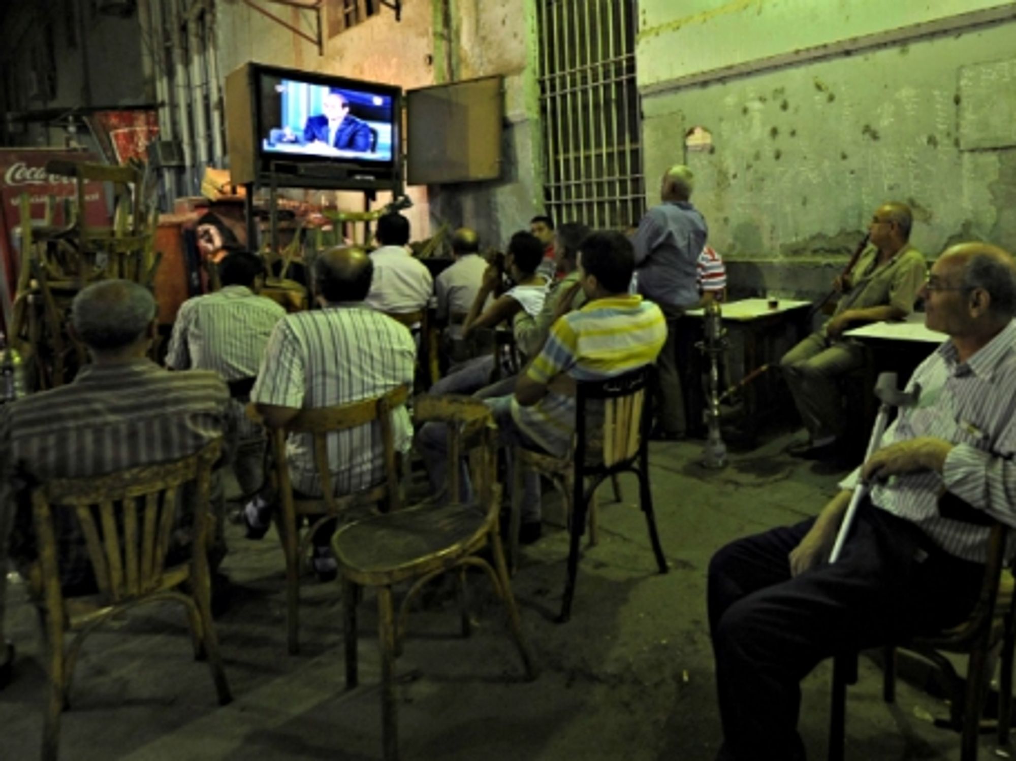 Watching the news in Cairo
