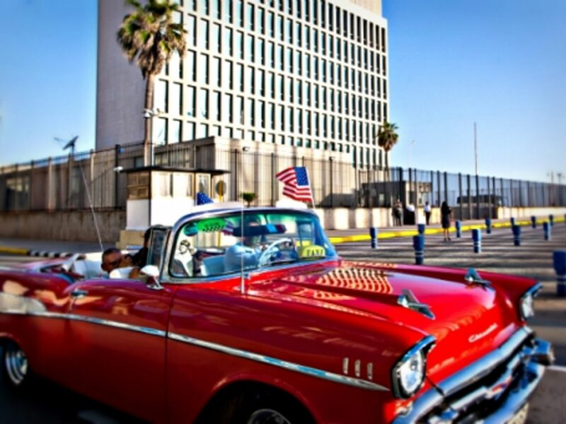 Waving a U.S. flag near the just reopened U.S. embassy in Havana.