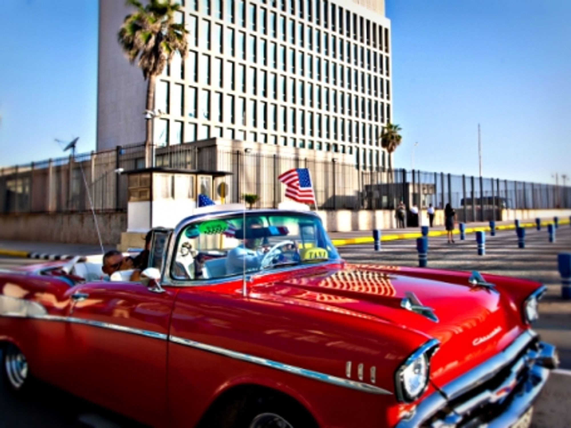 Waving a U.S. flag near the just reopened U.S. embassy in Havana.