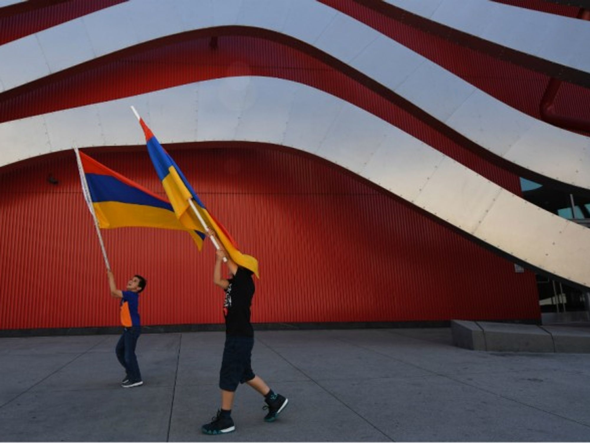 Waving Armenian flags wave flags at an LA march commemorating the Armenian genocide