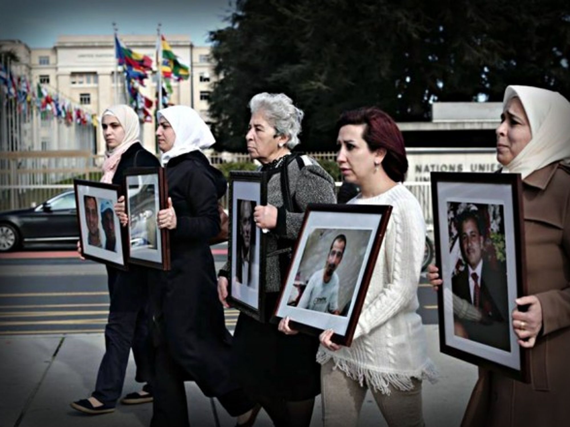 With photographs of 'disappeared' loved ones in front of Geneva peace talks