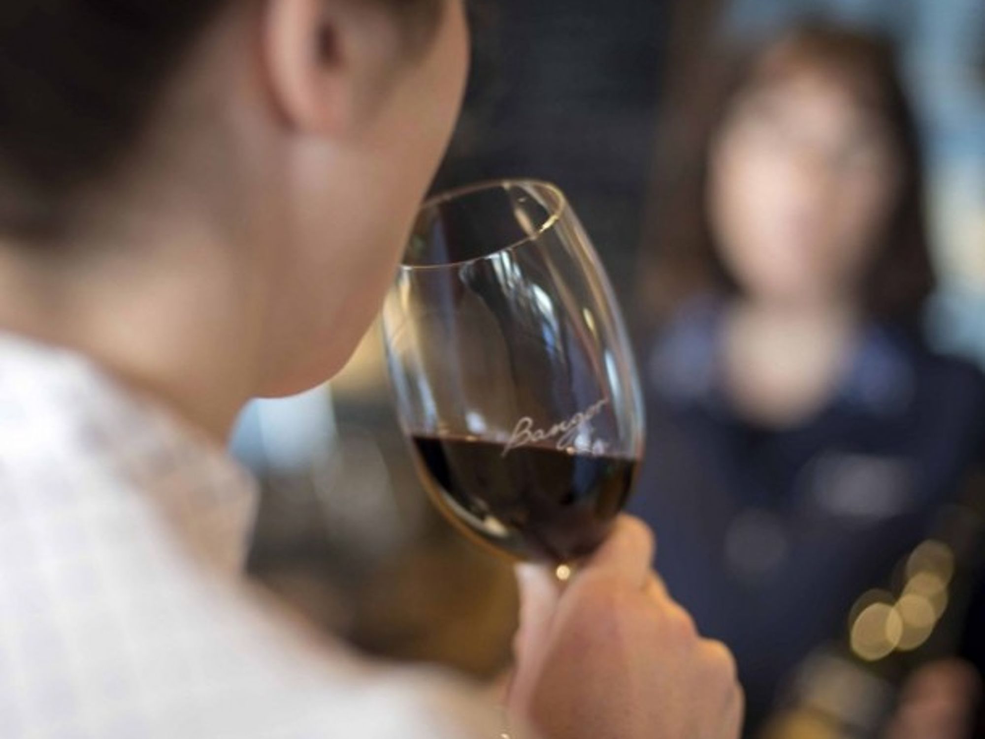 Woman at wine testing, in Tasmania, Australia.