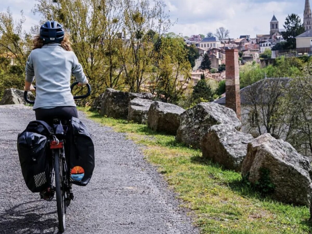 Woman biking at the Thouet Valley during a microadventure.